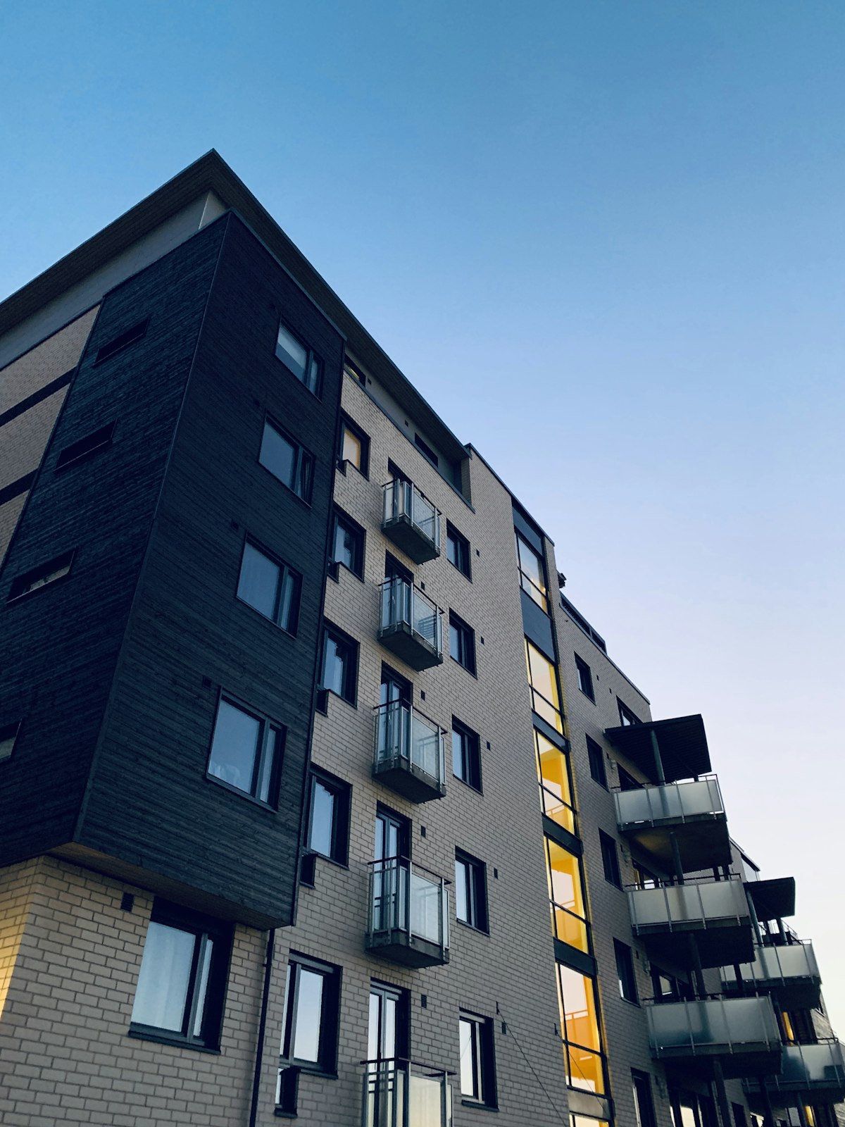 Modern multifamily apartment complex — the type of property where operators save the most by bringing utility billing in-house